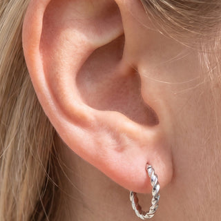 Spiral Ear Piercings – selection on linen
